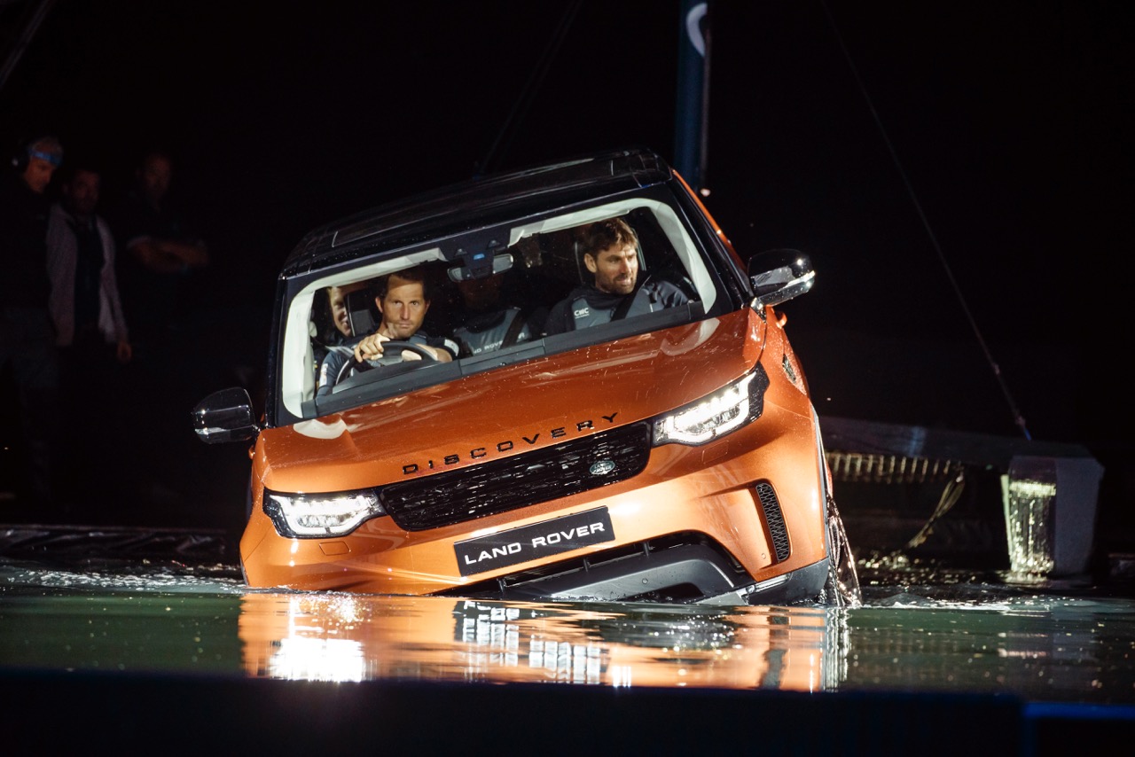 land-rover-bar-team-principal-sir-ben-ainslie-drives-the-new-land-rover-discovery-at-global-unveiling-at-packington-hall-solihull-uk-accompanied-by-team-manager-jono-macbeth