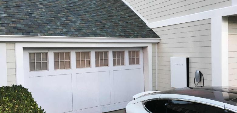tesla-s-electric-car-powerwall-and-solar-roof-are-shown-at-an-un-2